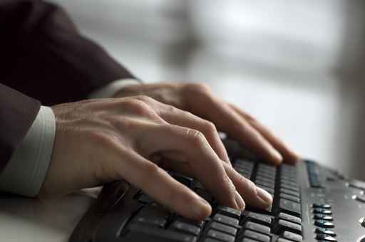 Picture of family working on computer at home