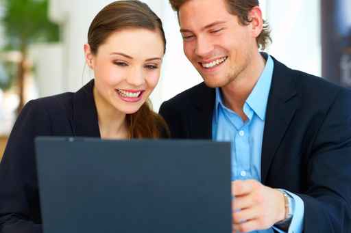 Picture of family working on computer at home