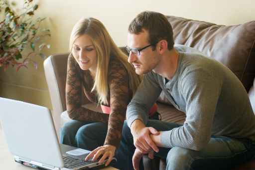 Picture of family working on computer at home